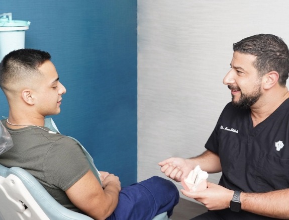 Dr. shihabi and dental patient 