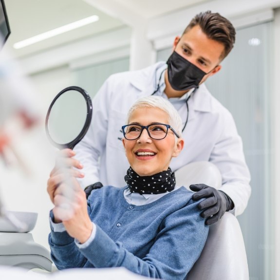 dentist showing woman new smile