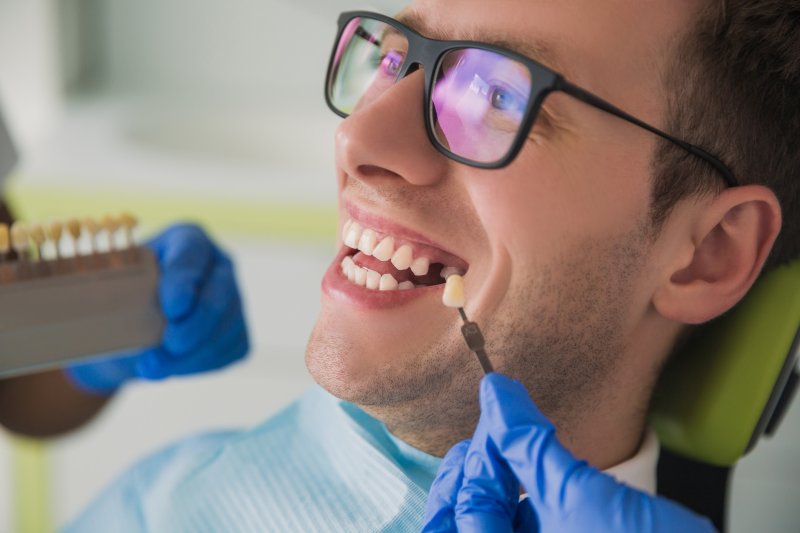 man with glasses and a missing tooth